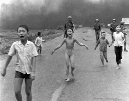 South Vietnamese soldiers escort terrified children after a napalm attack in June 1972.
