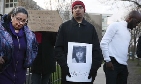 Donald Lightfoot holds a sign in support of Rekia Boyd while joining other protesters in Chicago on Monday.