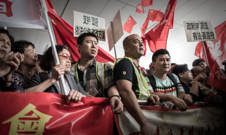 Pro-Beijing demonstrators stage a rally outside the government building in Hong Kong on Wednesday.  