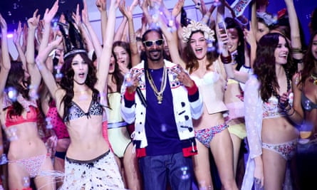 ‘It’s always a party’: Snoop Dogg with models on the catwalk during Paris fashion week, March 2015.