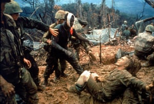 1966 Wounded US Marine gunnery sergeant Jeremiah Purdie (centre) is led past stricken comrades after a fierce firefight for control of Hill 484, south of DMZ in South Vietnam 