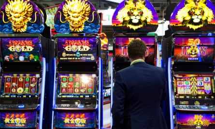 A gambler plays a 50 Lions slot machine at The Venetian casino.