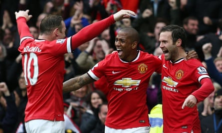 Ashley Young, middle, celebrates with Wayne Rooney, left, and Juan Mata after the latter's goal against Manchester City in the 4-2 win on 12 April, 2015.