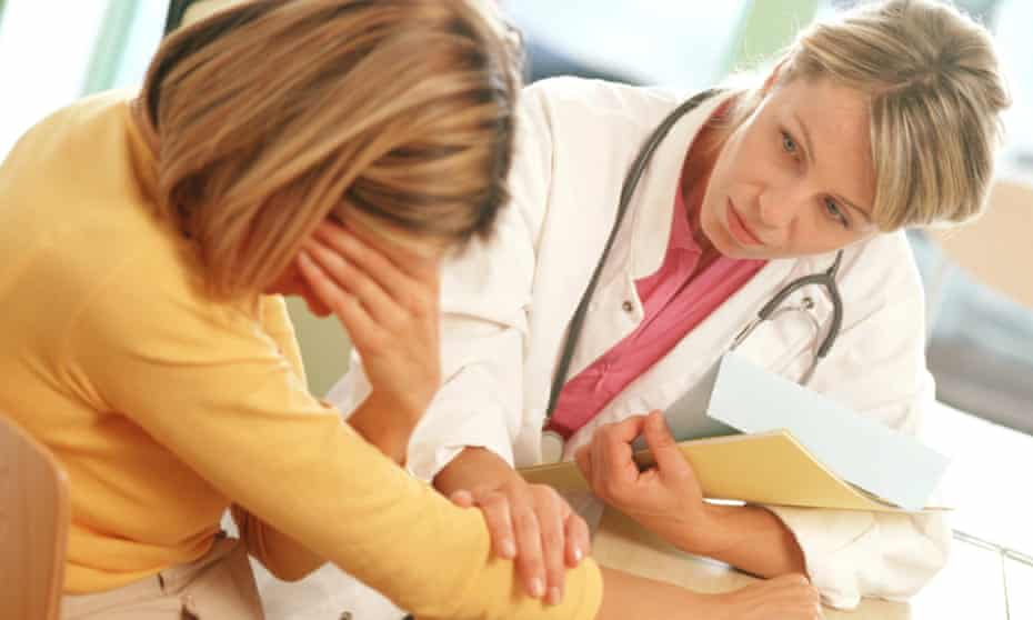 Woman consulting doctor
