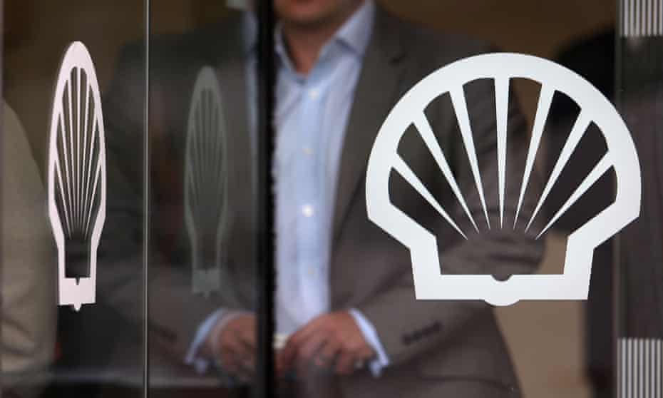 A visitor leaves the U.K. headquarters of Royal Dutch Shell Plc in London, U.K., on May 23, 2013.