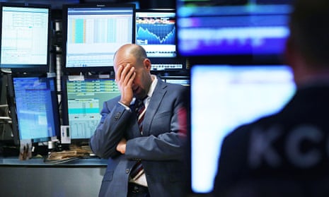 A trader on the floor of the New York Stock Exchange. The 'flash crash' of 2010 saw the largest ever
