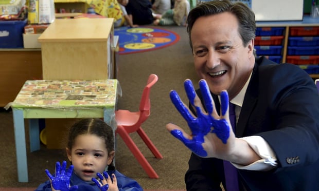 Cameron 'wanders between micro-managed photo-opportunities – a milk guzzling lamb, a paint-smeared child – bareheaded in the storms'.