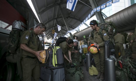 Israeli soldiers wait for a flight to Nepal from Tel Aviv. Many Israeli male couples have fathered children with the help of surrogate mothers in Nepal because surrogacy is illegal in Israel for same-sex couples.