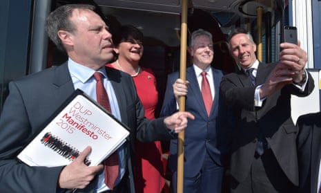 Ian Paisley Jr (right) takes a selfie with Northern Ireland first minister and DUP leader Peter Robinson (2nd left) alongside Arlene Foster and Nigel Dodds (left).