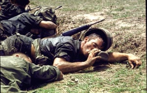 1970 An exhausted American infantryman drinks from his canteen in the Fishhook area of Cambodia