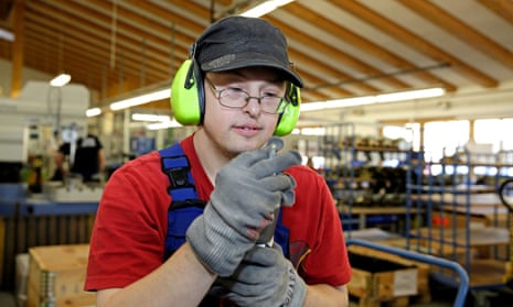 Young man with Down Syndrome in a workshop.