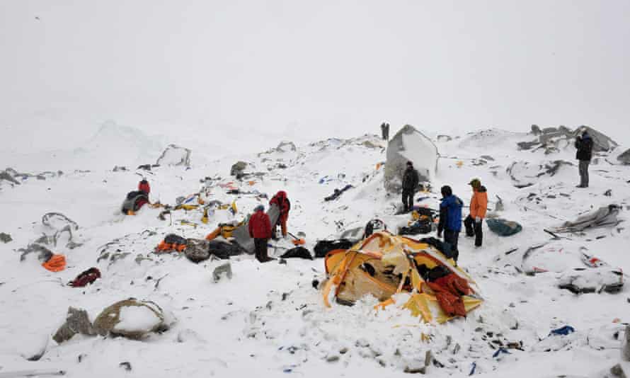 Rescuers look for survivors after the avalanche that flattened parts of the Everest base camp