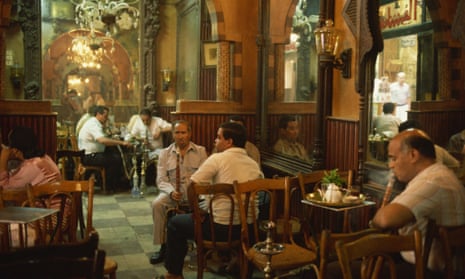 Men smoking at El Fishawy Coffee House in Khan al-Kalili Bazaar in Cairo, Egypt