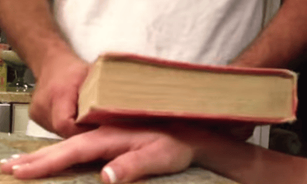 A ganglion cyst about to smashed with a book