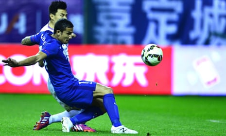 Tim Cahill, in the blue of Shanghai Shenhua, has been one of the standard bearers for the growing foreign influence in Chinese football.