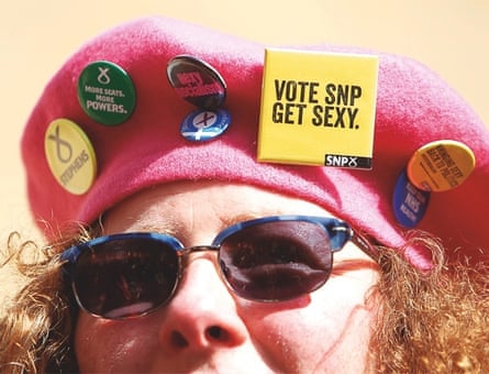 A female activist with badges on her beret at the launch of the SNP Women's Pledge