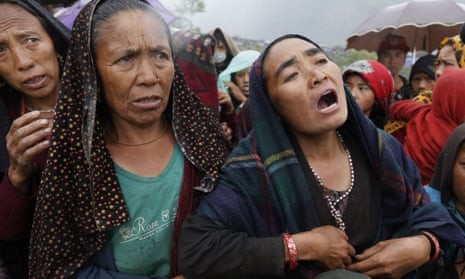 Villagers plead for food after an aid helicopter landed at the remote mountain village of Gumda, Gorkha district, Nepal.
