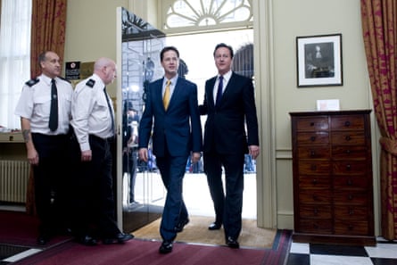 David Cameron and Nick Clegg walk into 10 Downing Street on 12 May 2010.