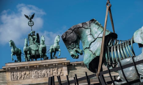 One of the 20 ‘pop-up’ horse sculptures is installed in front of the Brandenburg Gate in Berlin.