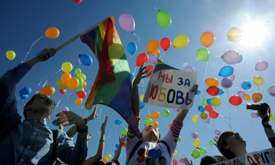 Gay rights activists release balloons as they take part in a rally in St Petersburg
