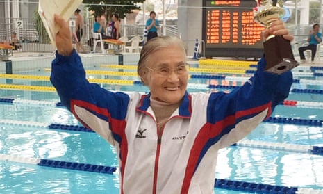 Mieko Nagaoka, a 100-year-old Japanese swimmer, celebrating in a masters swimming competition in Matsuyama, Ehime prefecture.