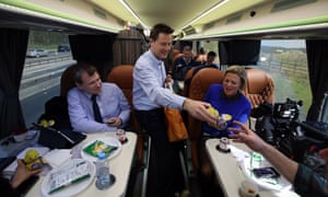 Liberal Democrat leader Nick Clegg hands out Easter eggs to the media traveling on the campaign bus to the west country