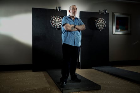 Taylor at a practice session in Manchester. He began playing darts with his father at the age of 12.
