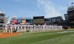 The New York Yankees line the field during the National Anthem before the game against the Toronto Blue Jays at Yankee Stadium.
