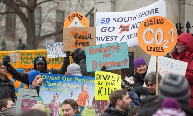 Environmentalists rally in Boston to demand state legislators support a bill that would require divestment from the state's fossil fuel holdings, 26 February 2014.