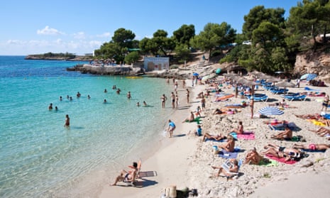 Tourists at the beach in Mallorca, Spain.