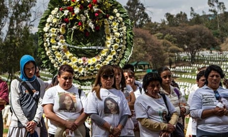 Mothers with missing daughters accompany Maria Eugenia Fuentes and her family at the funeral of her daughter Diana.