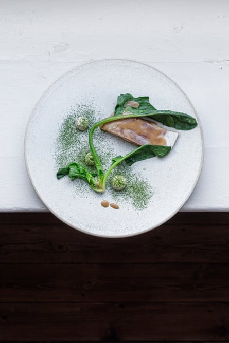 Brown butter-poached sea bass, spinach and oak-smoked roe