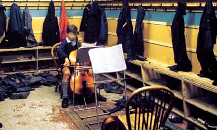 Boot room: a young musician finds a quiet spot to practise at Aberlour House.