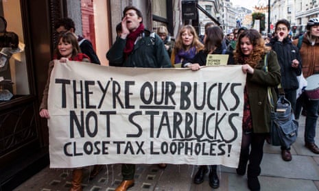 Protesters holding a banner outside Starbucks