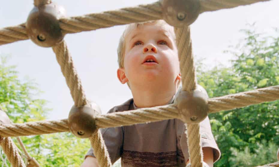 Boy climbing a net
