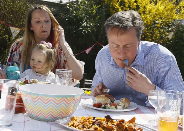 David Cameron eats a hot dog with a knife and fork