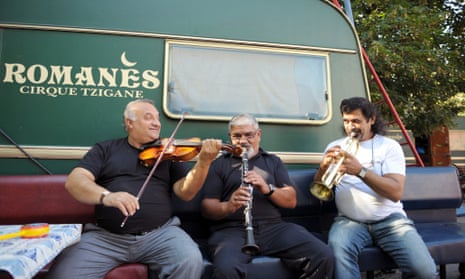 Musicians of the Romanes Gypsy circus on their way through Paris.