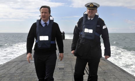 David Cameron with Cdr John Livesey during a visit on the nuclear-armed submarine HMS Victorious off the coast of Scotland in 2013.