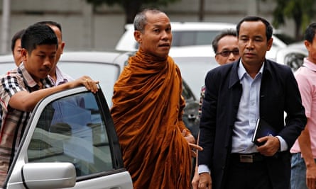 Thai Buddhist monk Phra Buddha Issara arrives at a police stationin Bangkok