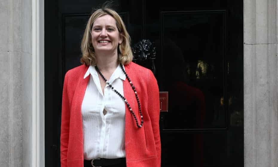 Amber Rudd waves as she arrives at 10 Downing Street. She takes charge as secretary of state for the Department of Energy and Climate Change.
