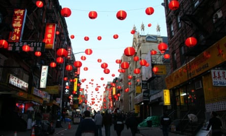 The same Chinatown street with lanterns.