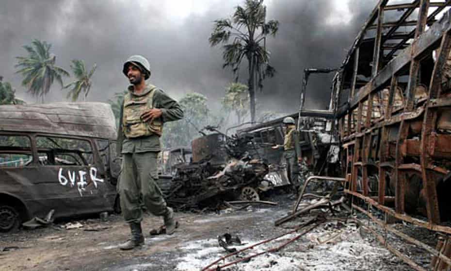 A Sri Lankan soldier walks among debris as the war with the Tamil Tigers came to a close.