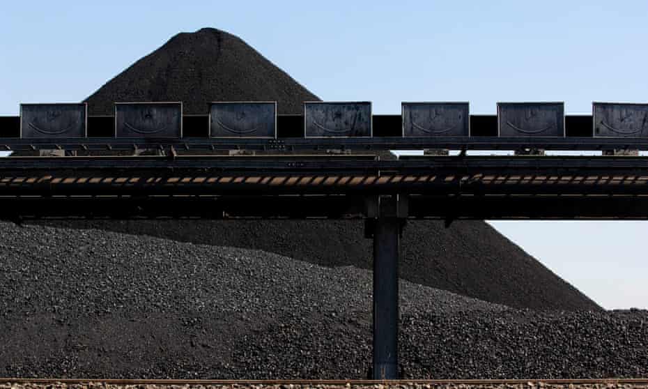 A mound of coal awaits loading onto a ship for export at Newcastle port, north of Sydney, Australia,