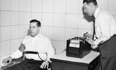 American inventor John Larson, right, demonstrates the operation of a polygraph or 'lie detector' at Northwestern University, Evanston, Illinois, in the 1930s.