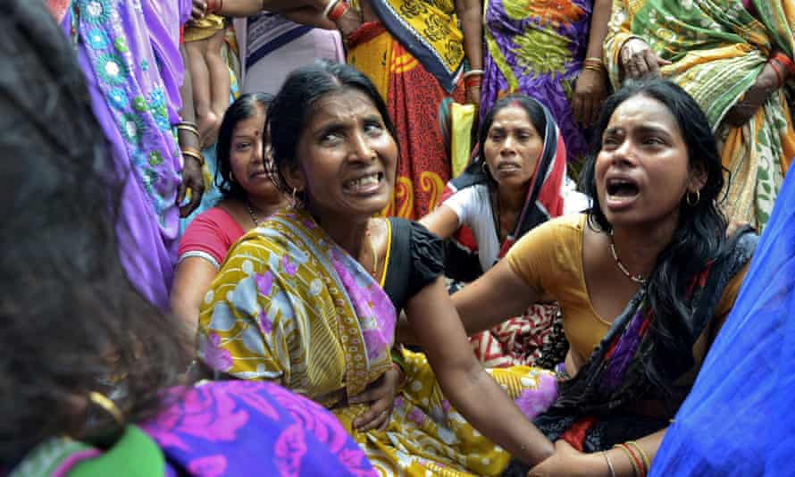 Women mourn the death of their relative who died after a wall collapsed in Bihar, India.
