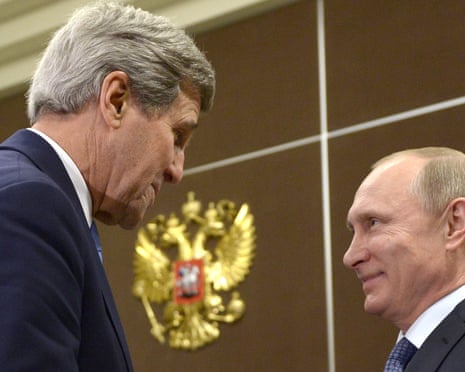 John Kerry and Vladimir Putin shake hands.