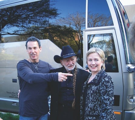 Willie Nelson in front of his tour bus with his manager, Mark Rothbaum, and Hillary Clinton