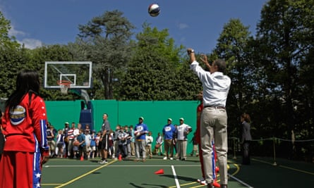 President Barack Obama plays with the Harlem Globetrotters in 2012.