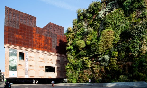 CaixaForum Museum and culture center, constructed by the Swiss architects Herzog & de Meuron next to the 'Green Wall' by PatrickMadrid