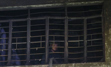A fireman inside the burnt-out factory.